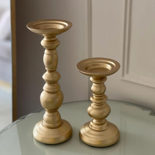 The Golden Candle Holders